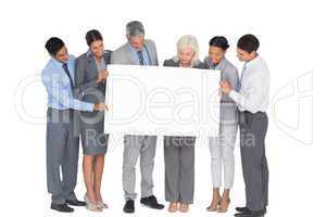 business people holding blank board