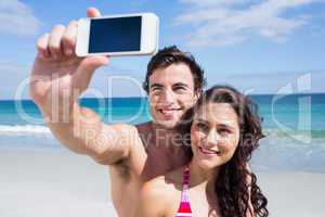 Happy couple taking selfie