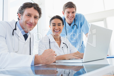 Team of doctors smiling at camera