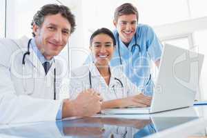 Team of doctors smiling at camera