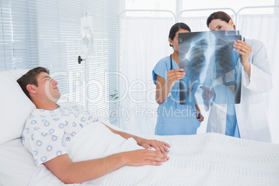 Doctors examining patients xray