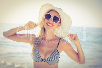 Stylish blonde on the beach