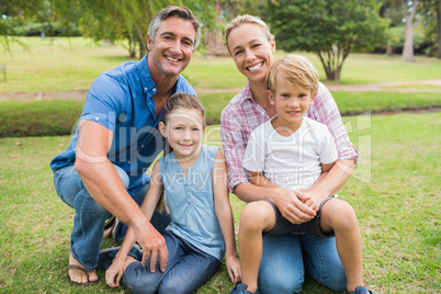 Happy family smiling at the camera