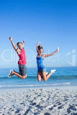 Happy couple jumping together