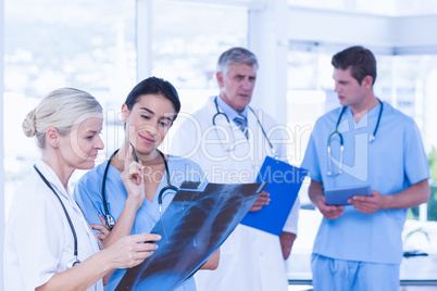 Team of smiling doctors discussing