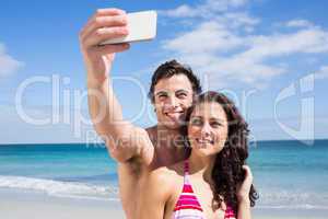 Happy couple taking selfie