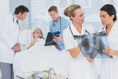 Doctors discussing about patients file