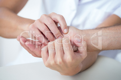 Doctor doing hand massage