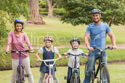 Happy family on their bike at the park