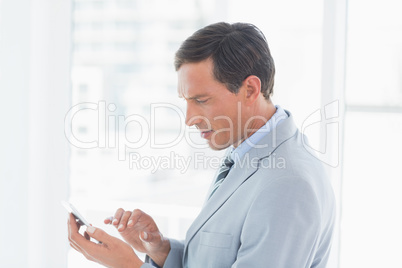 Concentrate businessman using tablet pc