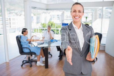 Smiling businesswoman introducing herself