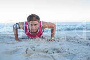 Handsome man doing push ups