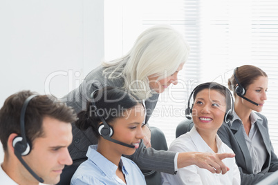 Businesswoman with executives using computers