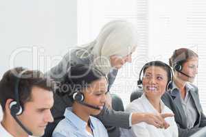 Businesswoman with executives using computers