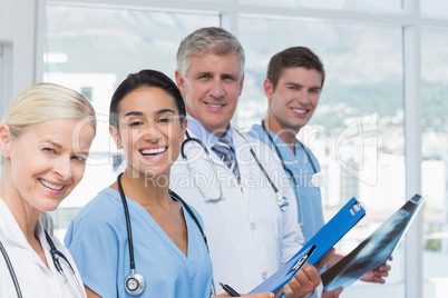 Team of smiling doctors looking at camera