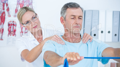 Doctor examining her patient back