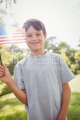 Little boy waving american flag