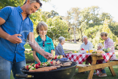 Happy family having picnic in the park