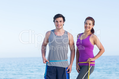 Couple measuring their waist