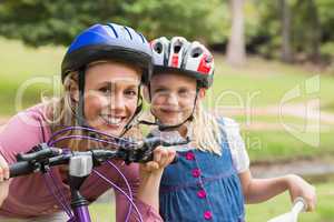 Mother and her daughter on their bike