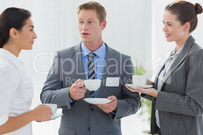 Business people drinking cup of coffee