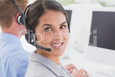 Smiling businesswoman wearing headset