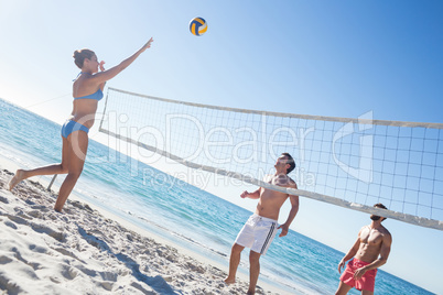 Friends playing volleyball