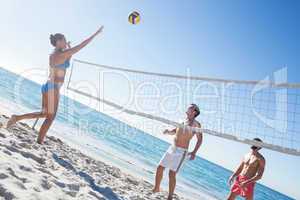 Friends playing volleyball