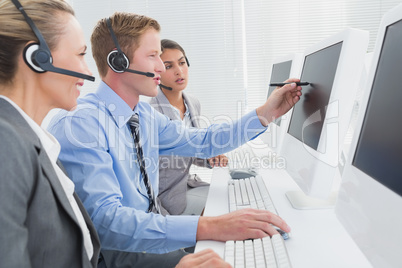 Businessman showing his screen to the team