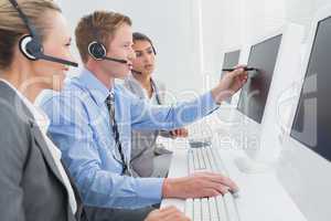 Businessman showing his screen to the team