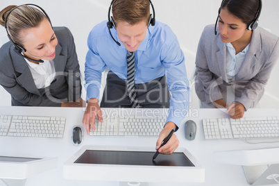 Businessman showing his screen to the team