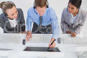 Businessman showing his screen to the team