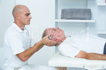 Man receiving head massage