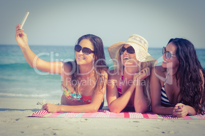 Friends in swimsuits taking a selfie