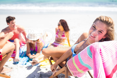 Happy friends sunbathing together