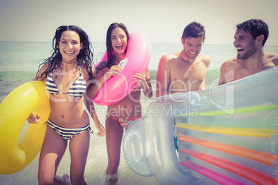 Happy friends having fun at the beach