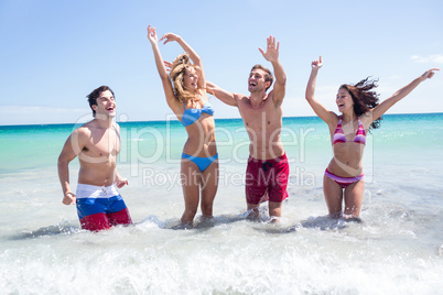 Happy friends having fun in the water together