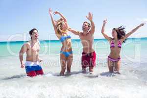 Happy friends having fun in the water together