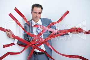 Businessman trapped by red tape