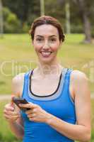 Pretty brunette using smartphone