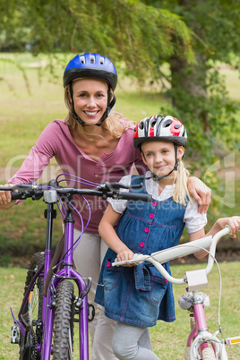 Mother and her daughter on their bike