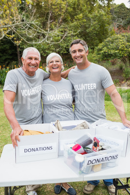 Happy family volunteer smiling at camera