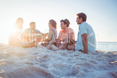 Happy hipsters relaxing and playing guitar Happy hipsters relaxing and playing guitar
