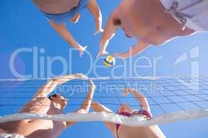 Group of friends playing volleyball