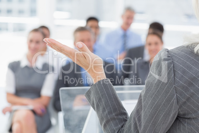 Businesswoman doing speech during meeting