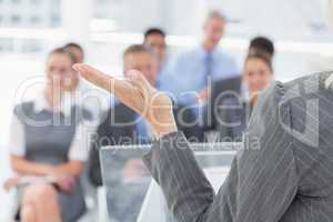 Businesswoman doing speech during meeting