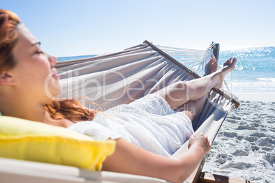 Brunette relaxing in the hammock