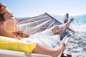 Brunette relaxing in the hammock