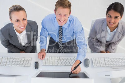 Businessman showing his screen to the team