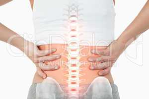 Highlighted spine of woman with back pain